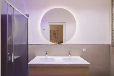 a bathroom with a sink and a mirror at THE BREAK - Campo Marzio Maison Deluxe in Rome