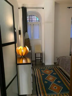a bedroom with a bed and a table with a bowl on it at nel cuore di trastevere in Rome