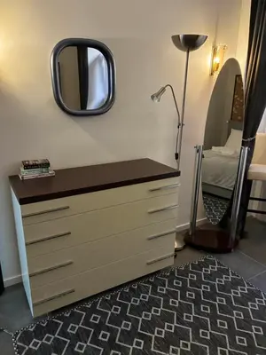a bedroom with a dresser with a mirror on the wall at nel cuore di trastevere in Rome