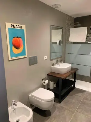 a bathroom with a sink and a toilet and a sink at nel cuore di trastevere in Rome