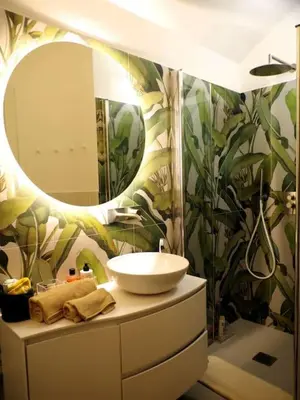 a bathroom with a sink and a mirror at DomusLatina Monti - Luxury stay in the heart of Rome in Rome