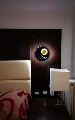 a hotel room with a bed and a desk at MBS Marconi Bridge Suites Guest House in Rome