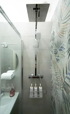 a bedroom with a wall with a picture of a planet at MBS Marconi Bridge Suites Guest House in Rome