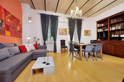 a living room with a couch and a table at Apartment Vespucci in Rome