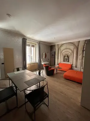 a living room with a couch and a table at Colosseum Vibes in Rome