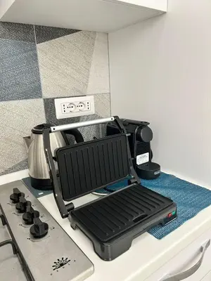 a drying rack sitting on top of a kitchen counter at Niva holiday house in Rome
