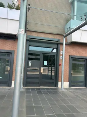 an entrance to a building with two revolving doors at Dina Suite Rome in Rome