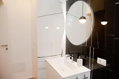 a bedroom with a bed and a tv on a wall at Casa Vacanze Roma in Rome