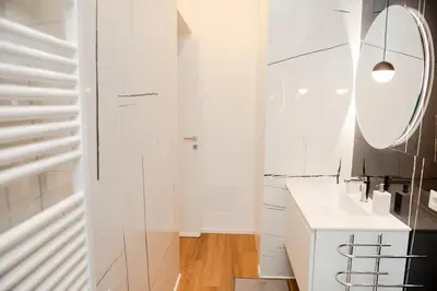 a bathroom with a toilet and a glass shower at Casa Vacanze Roma in Rome