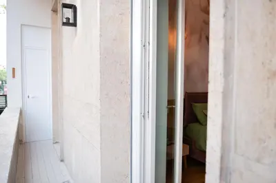 a white bathroom with a sink and a mirror at Casa Vacanze Roma in Rome