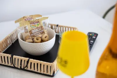 a bowl of peanuts and a bowl of snacks on a table at Dylan Apartment in Rome