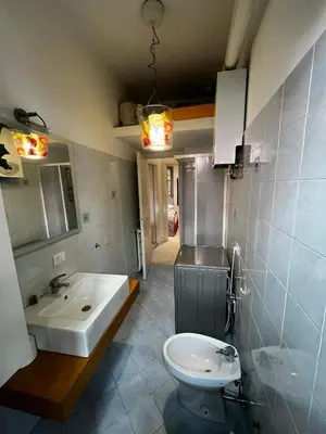a bathroom with a sink and a toilet at Procida's House by ACS HOLIDAYS in Rome