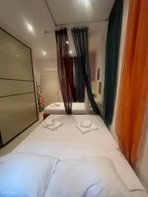 a bed in a room with two towels on it at Procida's House by ACS HOLIDAYS in Rome