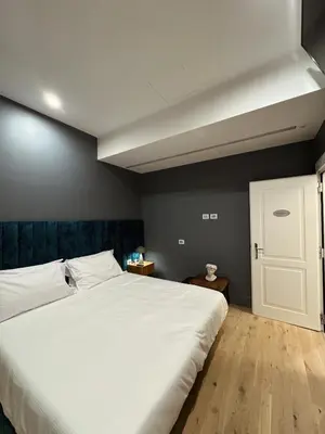 a bedroom with a large white bed in a room at Residenza Imperiale - Luxury Guest House in Rome