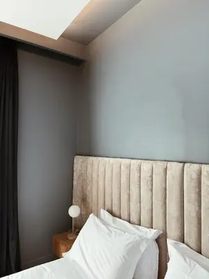 a bedroom with a bed with a large headboard at Residenza Imperiale - Luxury Guest House in Rome