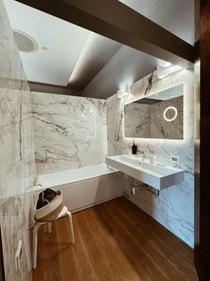 a bathroom with a sink and a bath tub and a mirror at Residenza Imperiale - Luxury Guest House in Rome