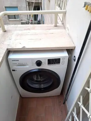 a washing machine with a counter on top of it at Suite dolce vita - san pietro in Rome