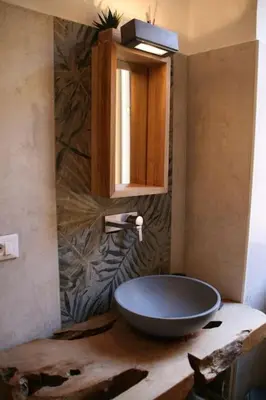 a bathroom with a bowl sink on a counter at Great Apartment in great Location in Rome