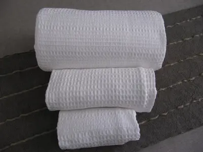 a stack of white towels on the floor at Matteo al Vaticano Vicino Metro in Rome