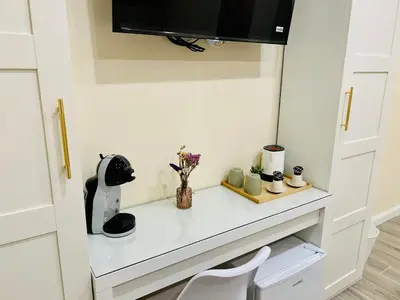 a room with a white counter with a white chair at Domus Altino in Rome