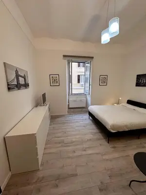 a room with a bathroom with a toilet and a sink at PGL San Lorenzo in Rome