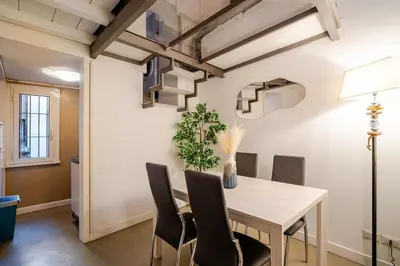 a dining room with a table and chairs at Maison Campo De Fiori in Rome