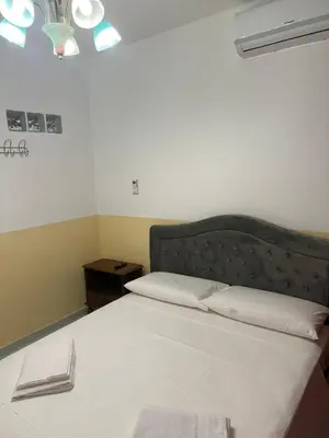 a bedroom with a large bed with a headboard at SALENTINI APPARTAMENTo in Rome