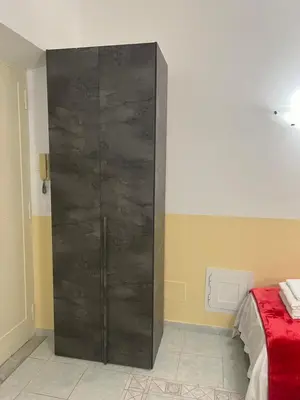 a room with a large black closet with a bed at SALENTINI APPARTAMENTo in Rome