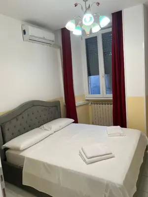 a bedroom with a bed with two towels on it at SALENTINI APPARTAMENTo in Rome