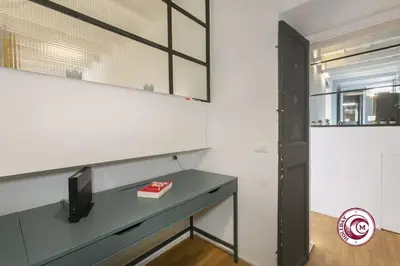 a room with a desk and a mirror at C M Fori Imperiali Apartment in Rome