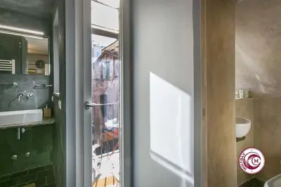 a door to a room with a view of a city at C M Fori Imperiali Apartment in Rome