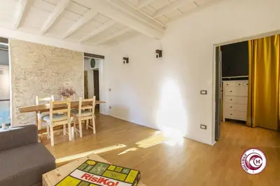 a living room with a couch and a table at C M Fori Imperiali Apartment in Rome