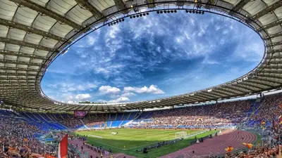 a stadium full of people watching a soccer game at Guinera Guest House in Rome