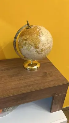 a globe sitting on top of a wooden table at Roma nel Mondo in Rome