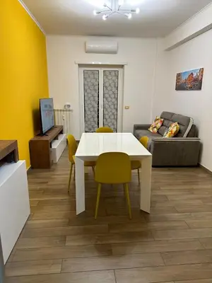 a living room with a white table and a couch at Roma nel Mondo in Rome