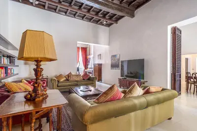 a living room with two couches and a table at iFlat Pantheon Elegant 3-bedroom Apartment in Rome