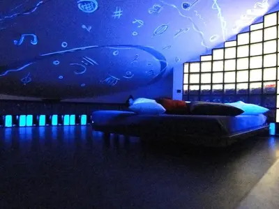 a room with a bed in a room with blue lights at Jazz Style Home in Rome
