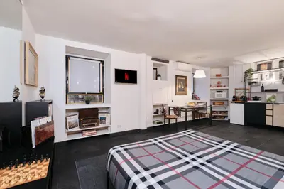 a bedroom with a bed and a desk in it at Casa Calligarich Stadio Olimpico Foro Italico in Rome