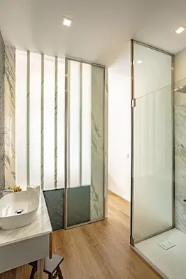 a bathroom with a glass shower and a sink at a casa di Manuela luxury apartment in Rome