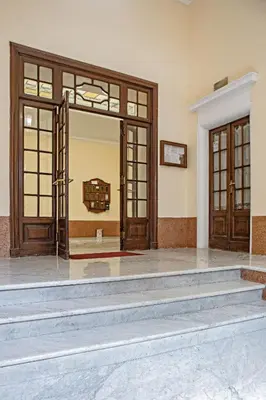 an empty room with two doors and stairs at a casa di Manuela luxury apartment in Rome