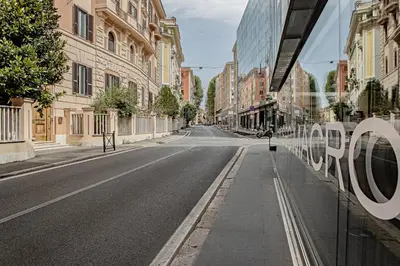 an empty street in a city with buildings at a casa di Manuela luxury apartment in Rome