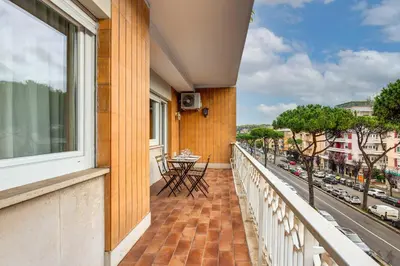 a balcony with a table and a view of a street at Presidential Vatican Palace II in Rome