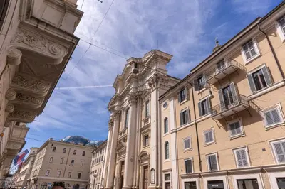 a large building with a clock tower in a city at Domus in Via Del Corso in Rome