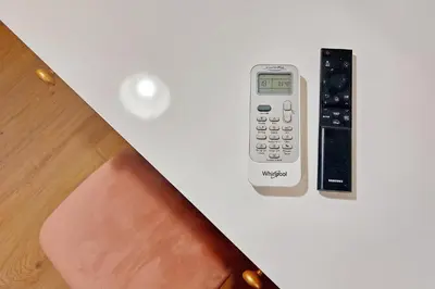 a remote control sitting on top of a table at Appia Holiday Home in Rome