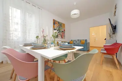 a dining room with a table and chairs at Appia Holiday Home in Rome
