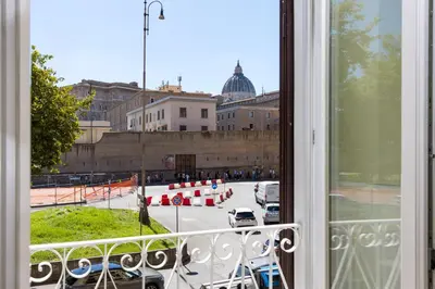 a balcony with a view of a street with traffic cones at Risorgimento 9 - Guest House in Rome
