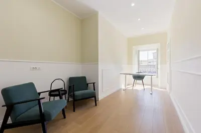 a room with chairs and a table and a window at Risorgimento 9 - Guest House in Rome