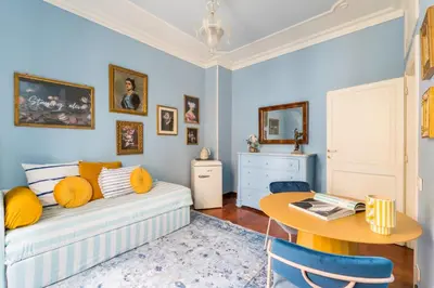 a living room with a couch and a table at Casa Tudor, Charmy Eccentric Flat in Piccola Londra 10 Min from City Center in Rome
