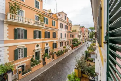 a city street with buildings and a canal at Casa Tudor, Charmy Eccentric Flat in Piccola Londra 10 Min from City Center in Rome