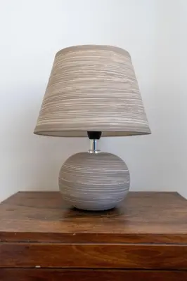 a lamp sitting on top of a wooden table at Rome Historic Center Stylehouse in Rome